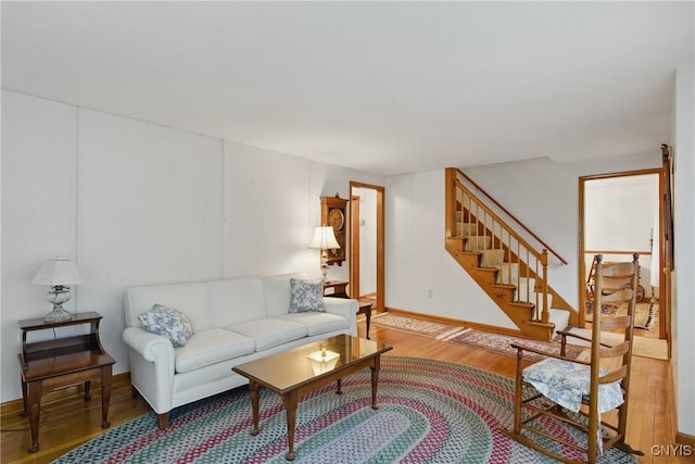 106 Lee Ter, Manlius, NY 13057 - living area with wood finished floors, stairs, and baseboards