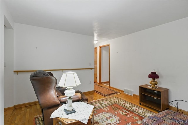106 Lee Ter, Manlius, NY 13057 - sitting room with wood finished floors and baseboards