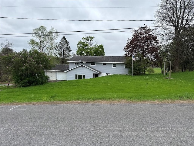37 Hilltop Dr, Schroeppel, NY 13135 - view of front of home with a garage and a front lawn