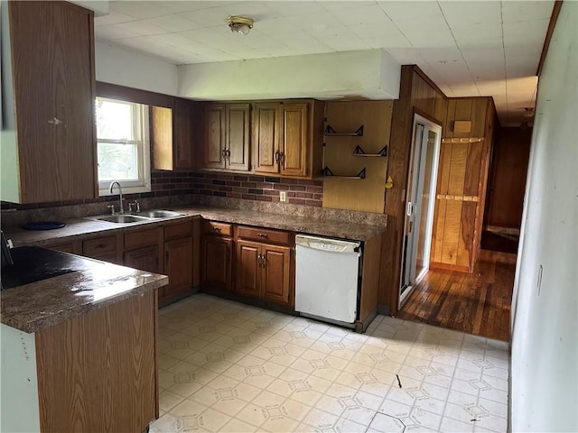 37 Hilltop Dr, Schroeppel, NY 13135 - kitchen featuring white dishwasher, a sink, dark countertops, open shelves, and light floors