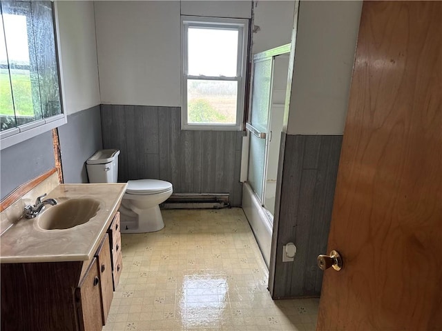 37 Hilltop Dr, Schroeppel, NY 13135 - full bath with a wainscoted wall, a baseboard radiator, plenty of natural light, tile patterned floors, and toilet