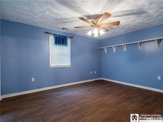 3830 E Ross Mills Rd, Ellicott, NY 14733 - unfurnished room with ceiling fan, baseboards, and dark wood-type flooring