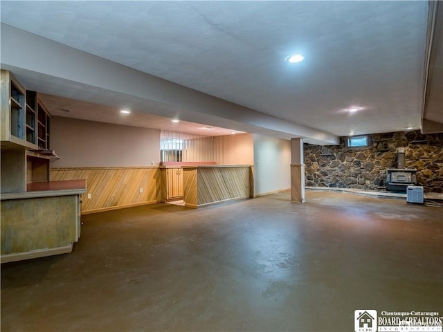3830 E Ross Mills Rd, Ellicott, NY 14733 - basement with a wood stove, wood walls, a wainscoted wall, and bar area