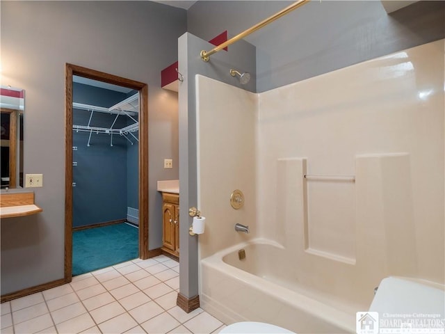 3830 E Ross Mills Rd, Ellicott, NY 14733 - bathroom with shower / washtub combination, vanity, tile patterned flooring, baseboards, and a walk in closet