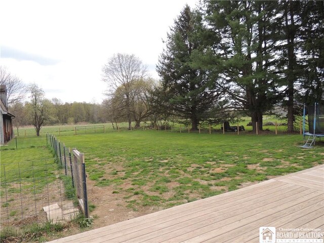 3830 E Ross Mills Rd, Ellicott, NY 14733 - view of yard with a trampoline, a deck, and a view of rural / pastoral area