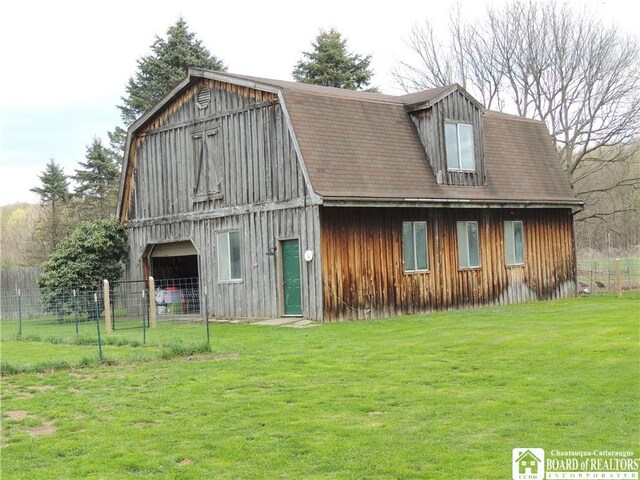 3830 E Ross Mills Rd, Ellicott, NY 14733 - rear view of house with a barn, a gambrel roof, an outbuilding, and board and batten siding