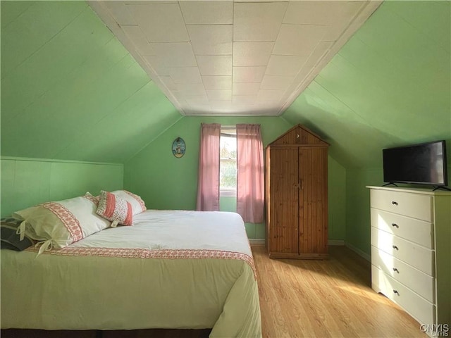 43815 Stine Rd, Alexandria, NY 13679 - bedroom featuring light wood finished floors, baseboards, and vaulted ceiling