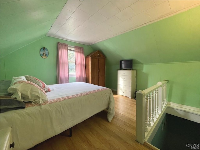 43815 Stine Rd, Alexandria, NY 13679 - bedroom with wood finished floors and lofted ceiling