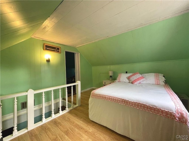 43815 Stine Rd, Alexandria, NY 13679 - bedroom with wood finished floors, vaulted ceiling, and baseboards