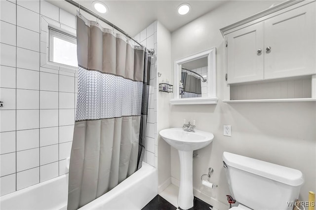 61 Norwalk Ave, Buffalo, NY 14216 - full bathroom featuring toilet, shower / bath combo with shower curtain, and a sink