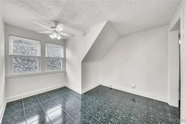 61 Norwalk Ave, Buffalo, NY 14216 - bonus room with ceiling fan, a textured ceiling, baseboards, and dark tile patterned floors