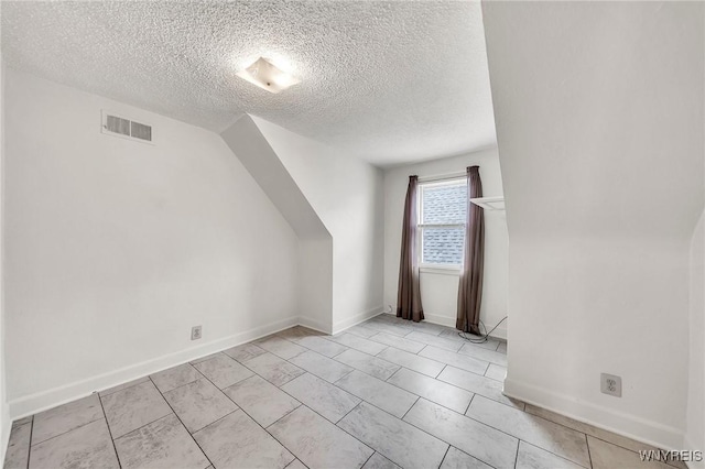 61 Norwalk Ave, Buffalo, NY 14216 - additional living space featuring a textured ceiling and baseboards