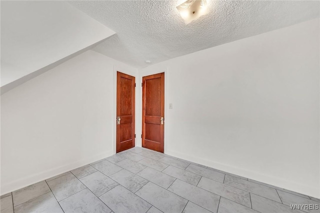 61 Norwalk Ave, Buffalo, NY 14216 - unfurnished room with a textured ceiling and baseboards