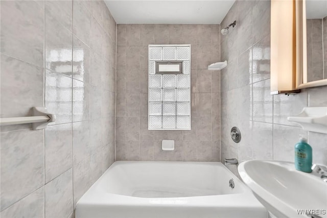 61 Norwalk Ave, Buffalo, NY 14216 - bathroom featuring tile walls, a sink, and shower / tub combination