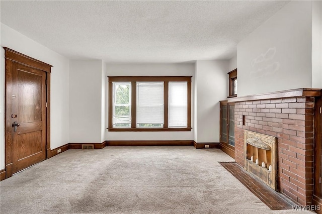 61 Norwalk Ave, Buffalo, NY 14216 - unfurnished living room with carpet floors, baseboards, a fireplace, and a textured ceiling
