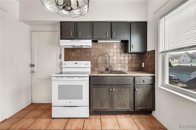 61 Norwalk Ave, Buffalo, NY 14216 - kitchen with white electric range oven, under cabinet range hood, a sink, tasteful backsplash, and a chandelier