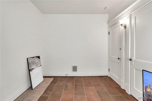 61 Norwalk Ave, Buffalo, NY 14216 - empty room with baseboards and dark tile patterned floors