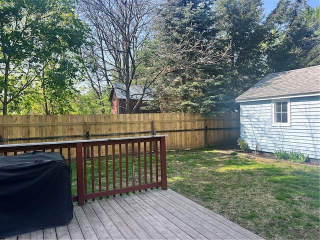 wooden deck with a grill
