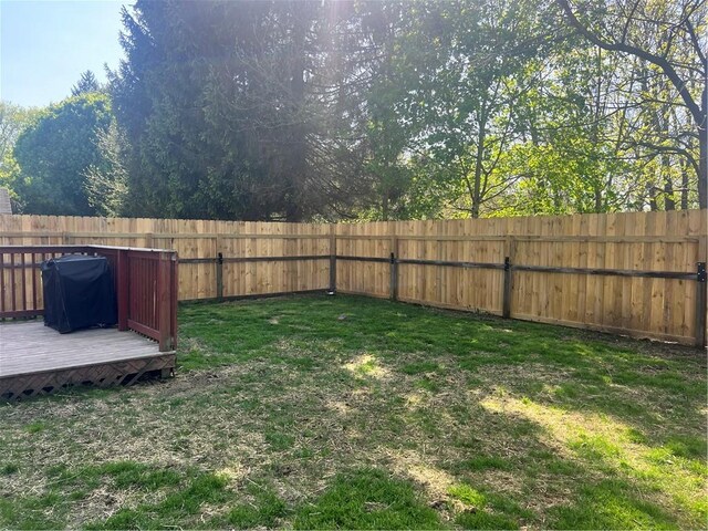 view of yard with a wooden deck