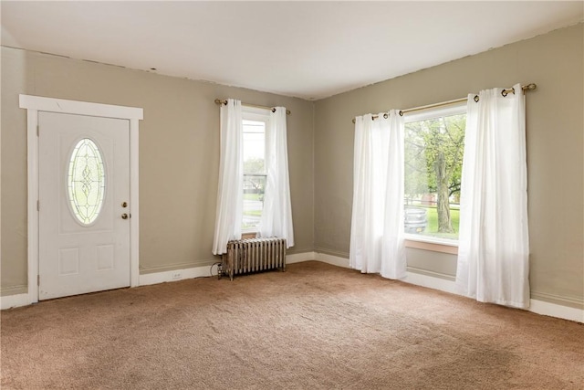448 Old Ithaca Rd, Horseheads, NY 14845 - foyer featuring radiator heating unit, carpet flooring, plenty of natural light, and baseboards