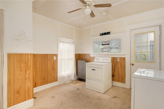 448 Old Ithaca Rd, Horseheads, NY 14845 - laundry room featuring radiator heating unit, light colored carpet, washing machine and dryer, ceiling fan, and a wainscoted wall