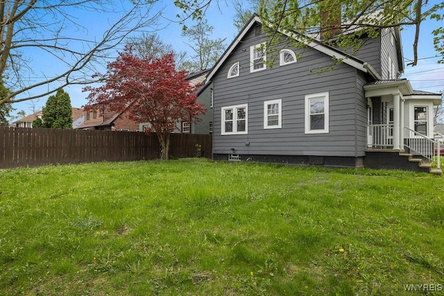 back of property with a chimney