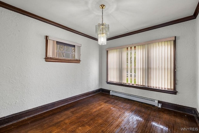 spare room with baseboard heating, crown molding, a chandelier, baseboards, and a textured wall