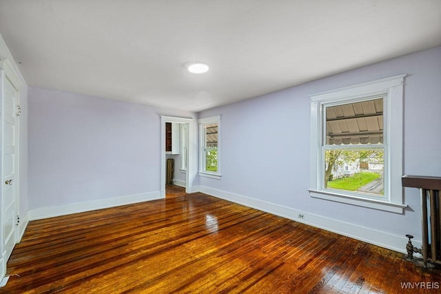 44 Christiana St, North Tonawanda, NY 14120 - spare room featuring wood-type flooring and baseboards