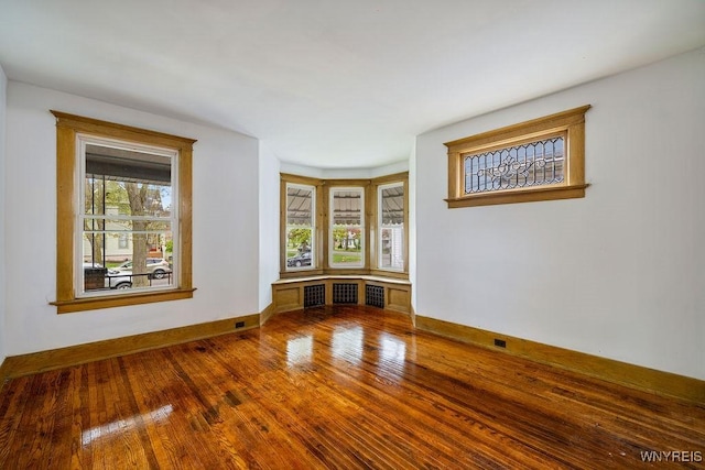 44 Christiana St, North Tonawanda, NY 14120 - empty room with baseboards and wood finished floors