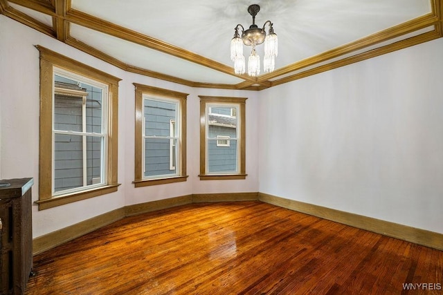 44 Christiana St, North Tonawanda, NY 14120 - spare room with a chandelier, wood finished floors, ornamental molding, and baseboards