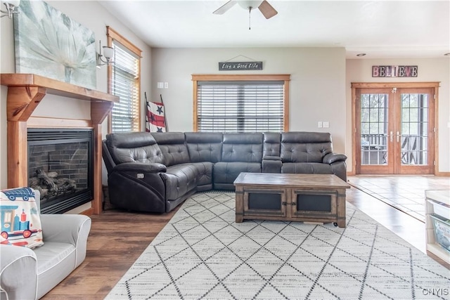 20948 Nys Rte 180, Hounsfield, NY 13634 - living area featuring a ceiling fan, healthy amount of natural light, a fireplace, and french doors