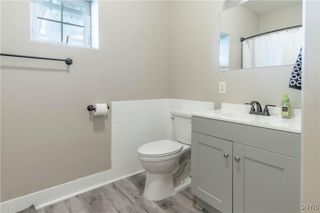 20948 Nys Rte 180, Hounsfield, NY 13634 - bathroom with toilet, wood finished floors, vanity, and baseboards