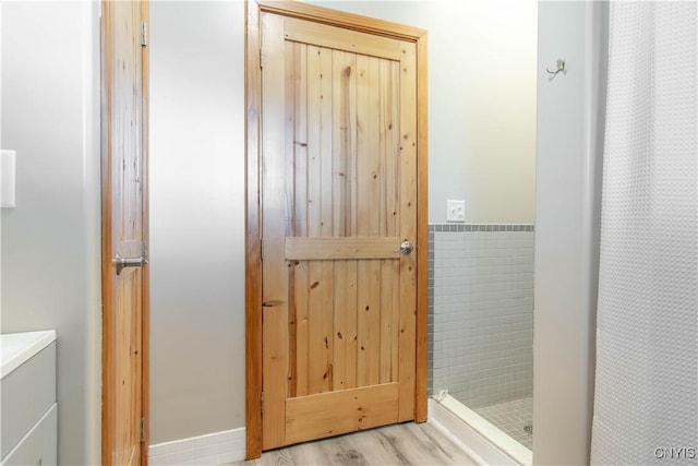 20948 Nys Rte 180, Hounsfield, NY 13634 - bathroom with a shower stall and wood finished floors