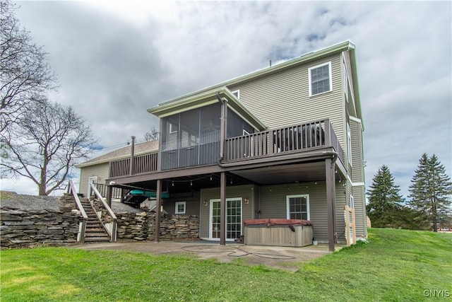 20948 Nys Rte 180, Hounsfield, NY 13634 - rear view of house with a hot tub, stairway, a sunroom, a lawn, and a wooden deck