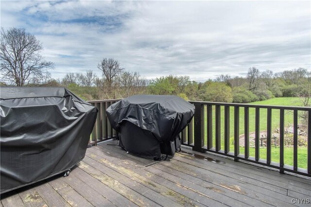 20948 Nys Rte 180, Hounsfield, NY 13634 - wooden deck with a grill