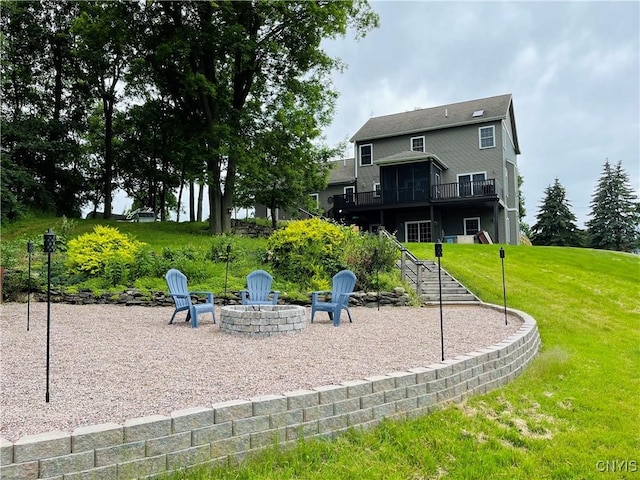 20948 Nys Rte 180, Hounsfield, NY 13634 - rear view of property with a fire pit, a yard, a deck, a patio, and stairs
