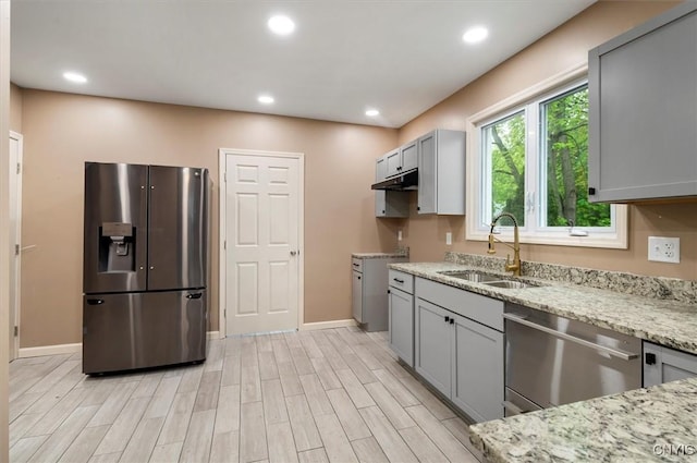 212 N Broad St, Oneida-Inside, NY 13421 - kitchen with stainless steel appliances, a sink, gray cabinets, light stone counters, and baseboards