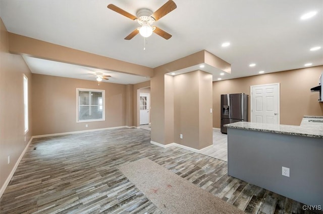 212 N Broad St, Oneida-Inside, NY 13421 - unfurnished living room featuring ceiling fan, light wood-style floors, baseboards, and recessed lighting