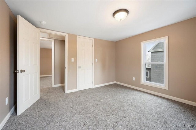 212 N Broad St, Oneida-Inside, NY 13421 - unfurnished bedroom with carpet floors and baseboards