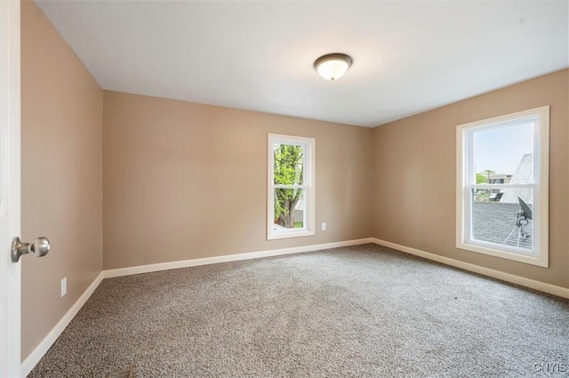 212 N Broad St, Oneida-Inside, NY 13421 - carpeted empty room with baseboards