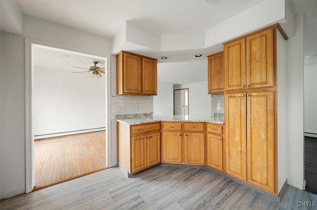 120 Getmac Ave, Lenox, NY 13032 - kitchen featuring light wood-style floors, a baseboard radiator, ceiling fan, decorative backsplash, and recessed lighting