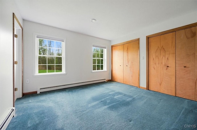 120 Getmac Ave, Lenox, NY 13032 - unfurnished bedroom with baseboard heating, multiple closets, and carpet flooring