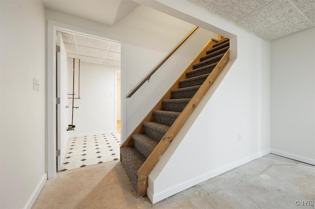120 Getmac Ave, Lenox, NY 13032 - stairway with a paneled ceiling, baseboards, and concrete flooring