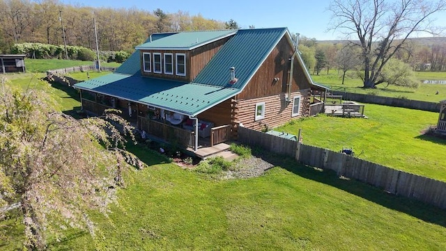 4138 Hubbs Rd, Hector, NY 14818 - view of side of property with log siding, a yard, and metal roof