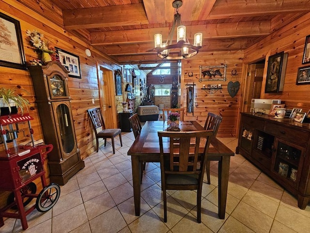 4138 Hubbs Rd, Hector, NY 14818 - dining area featuring wooden ceiling with exposed beams, wooden walls, a chandelier, and light tile patterned floors