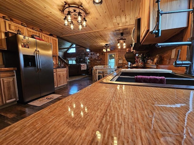 4138 Hubbs Rd, Hector, NY 14818 - kitchen featuring stainless steel fridge with ice dispenser, wood ceiling, dark wood-style flooring, wood walls, and brown cabinetry