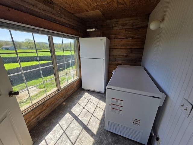 4138 Hubbs Rd, Hector, NY 14818 - kitchen featuring freestanding refrigerator, wood walls, refrigerator, and wood ceiling