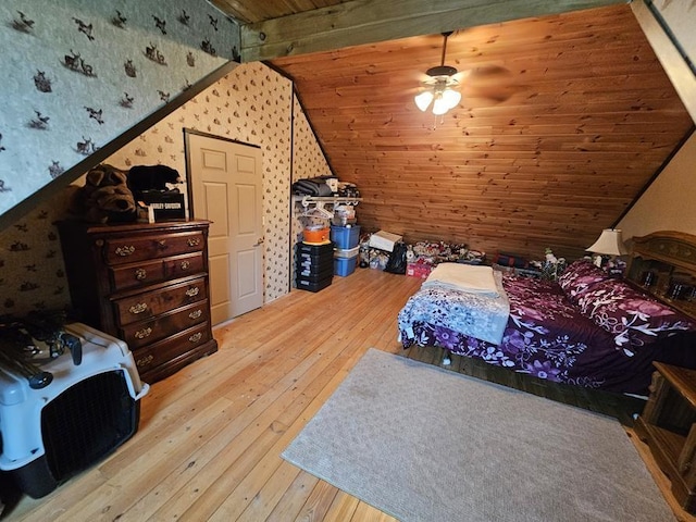 4138 Hubbs Rd, Hector, NY 14818 - bedroom featuring wallpapered walls, wood-type flooring, and vaulted ceiling