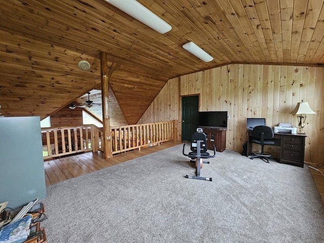 4138 Hubbs Rd, Hector, NY 14818 - home office featuring vaulted ceiling, carpet floors, wooden ceiling, wood walls, and a ceiling fan