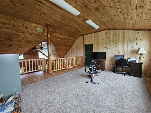 4138 Hubbs Rd, Hector, NY 14818 - home office with lofted ceiling, carpet flooring, wood ceiling, wood walls, and a ceiling fan